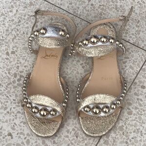 Christian Louboutin Gold Silver Sandals Paris. New newer worn.One missing sphere
